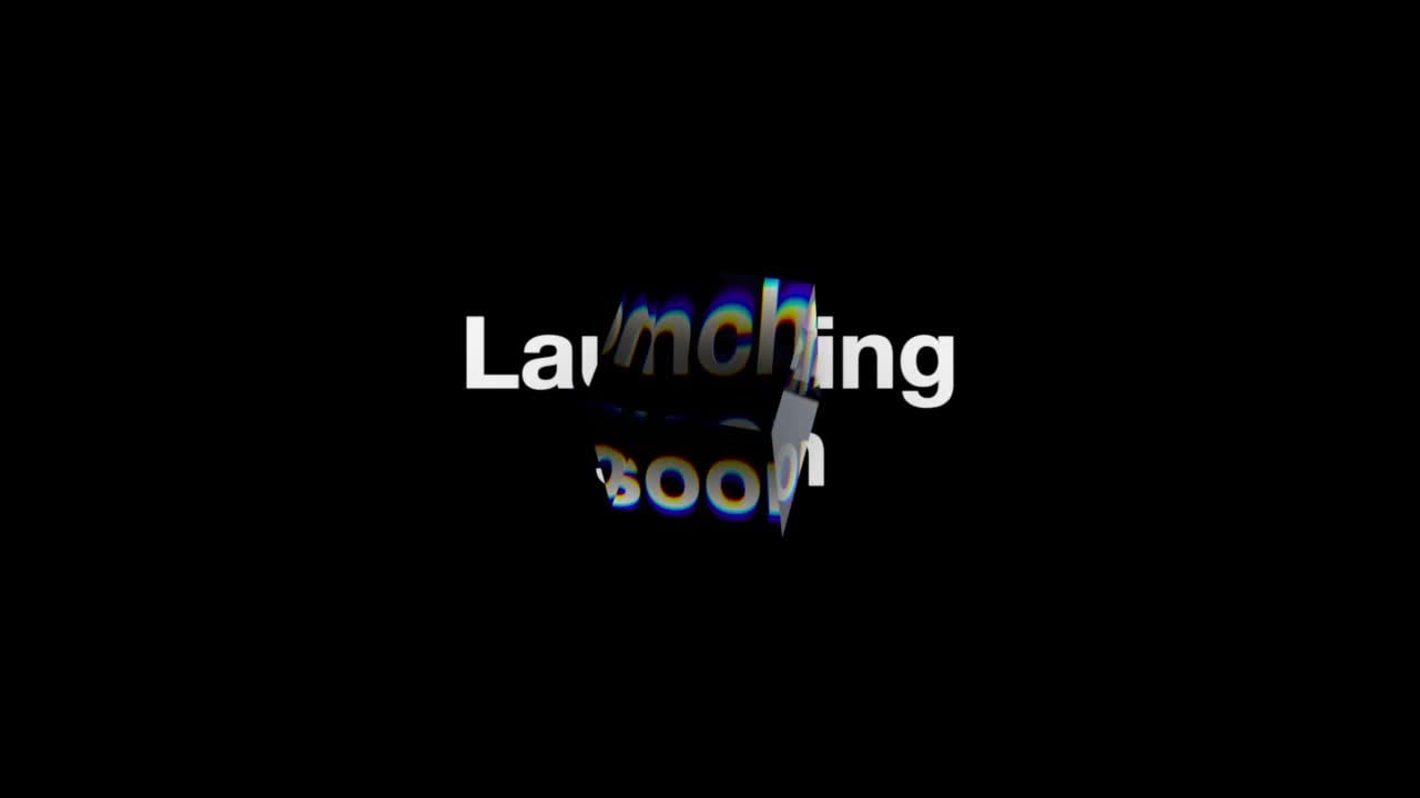 a video of the text "launching soon" with a clear cube moving over the text